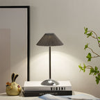 Contemporary Scandinavian rechargeable iron fabric conical folded LED table lamp for bedside