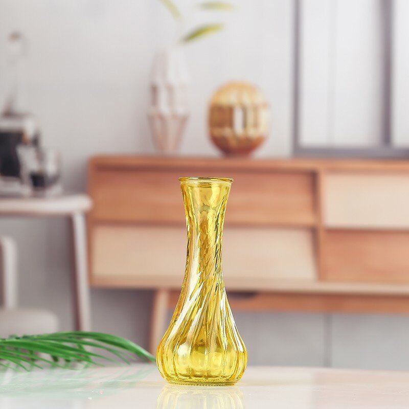 Handblown glass bud vase with fluted neck and weighted base